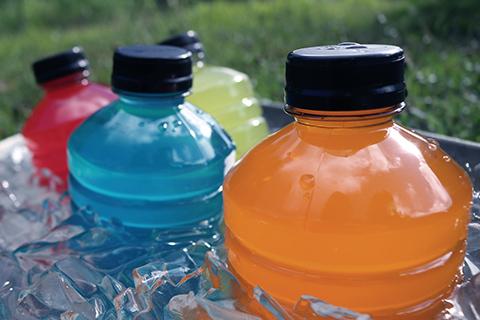Bottles of sports drinks sit on ice